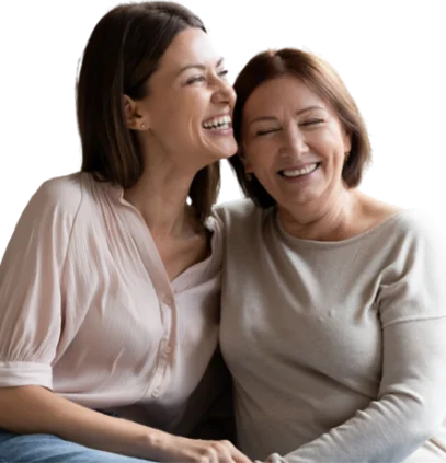 Two happy women gently embracing one another.