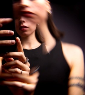A blurry image of a woman, symbolising the overwhelming and intrusive thoughts that she experiences from her OCD.