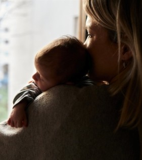 A woman experiencing perinatal anxiety after the birth of her child.